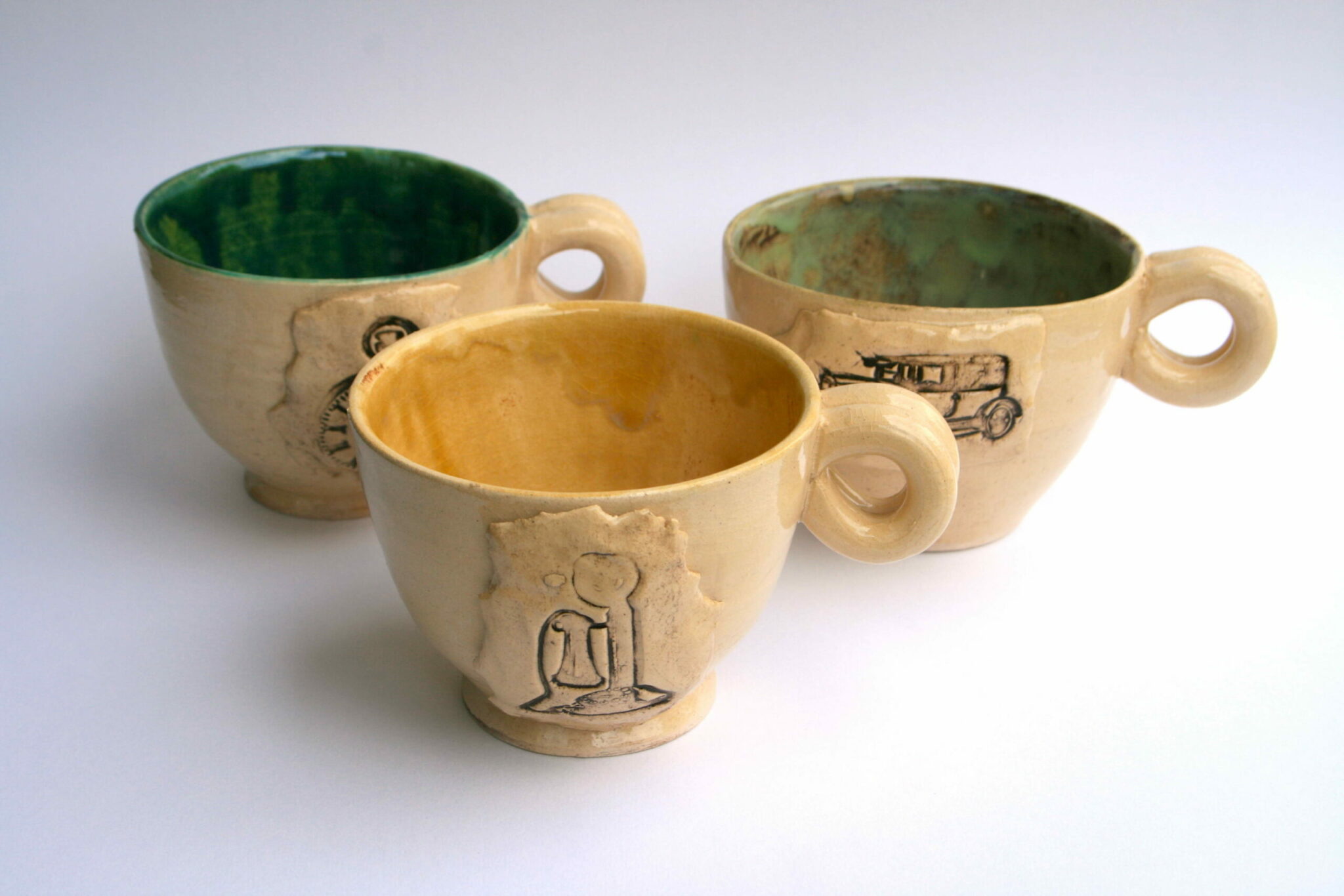Stamped clay mugs