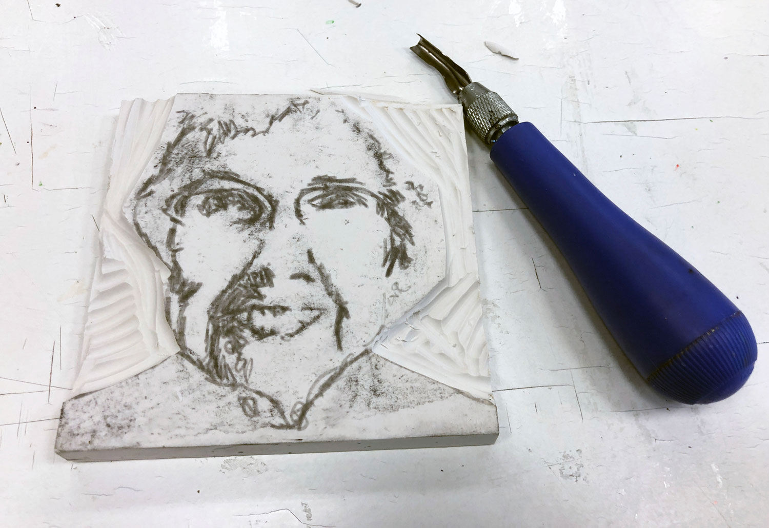An introduction to relief printmaking that covers the basics of using linoleum to make a portrait print. This assignment is turned into a mixed media project by incorporating Prisma colored pencils to fill in the skin tone of the portrait. This is one post in an art education blog hop. Visit and check out more!