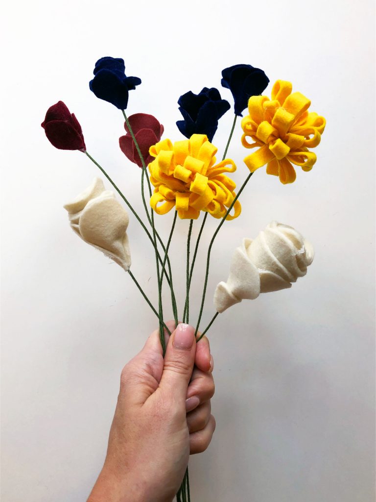 Felt flower bouquet in navy, off white, mustard, and dusty pink.